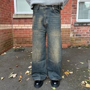 Men’s faded blue jeans with rust tint design